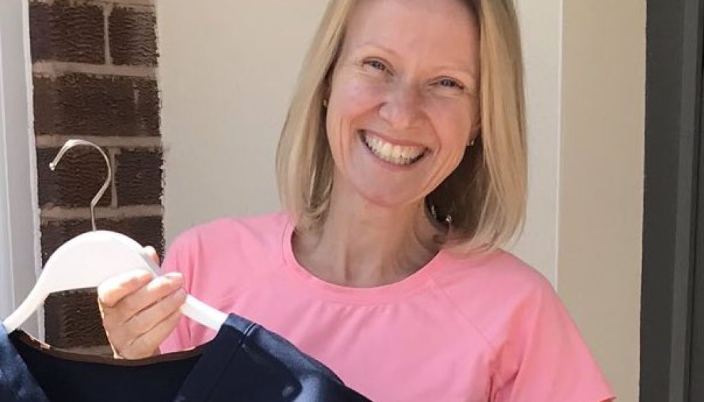 SQ Head of Textiles Mrs Jo Bishop proudly holding up Scrubs made during Pandemic copy