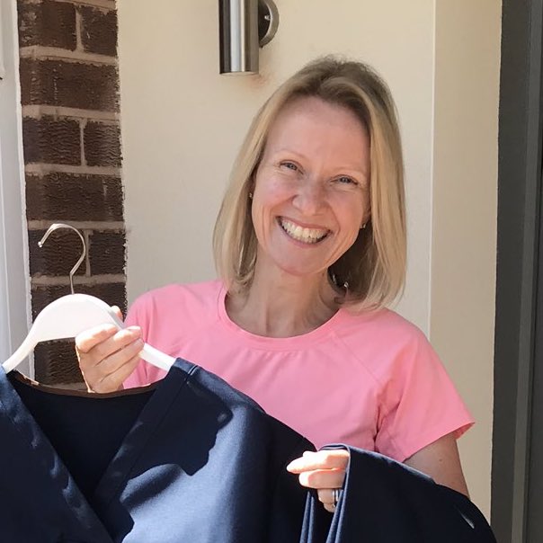 SQ Head of Textiles Mrs Jo Bishop proudly holding up Scrubs made during Pandemic copy