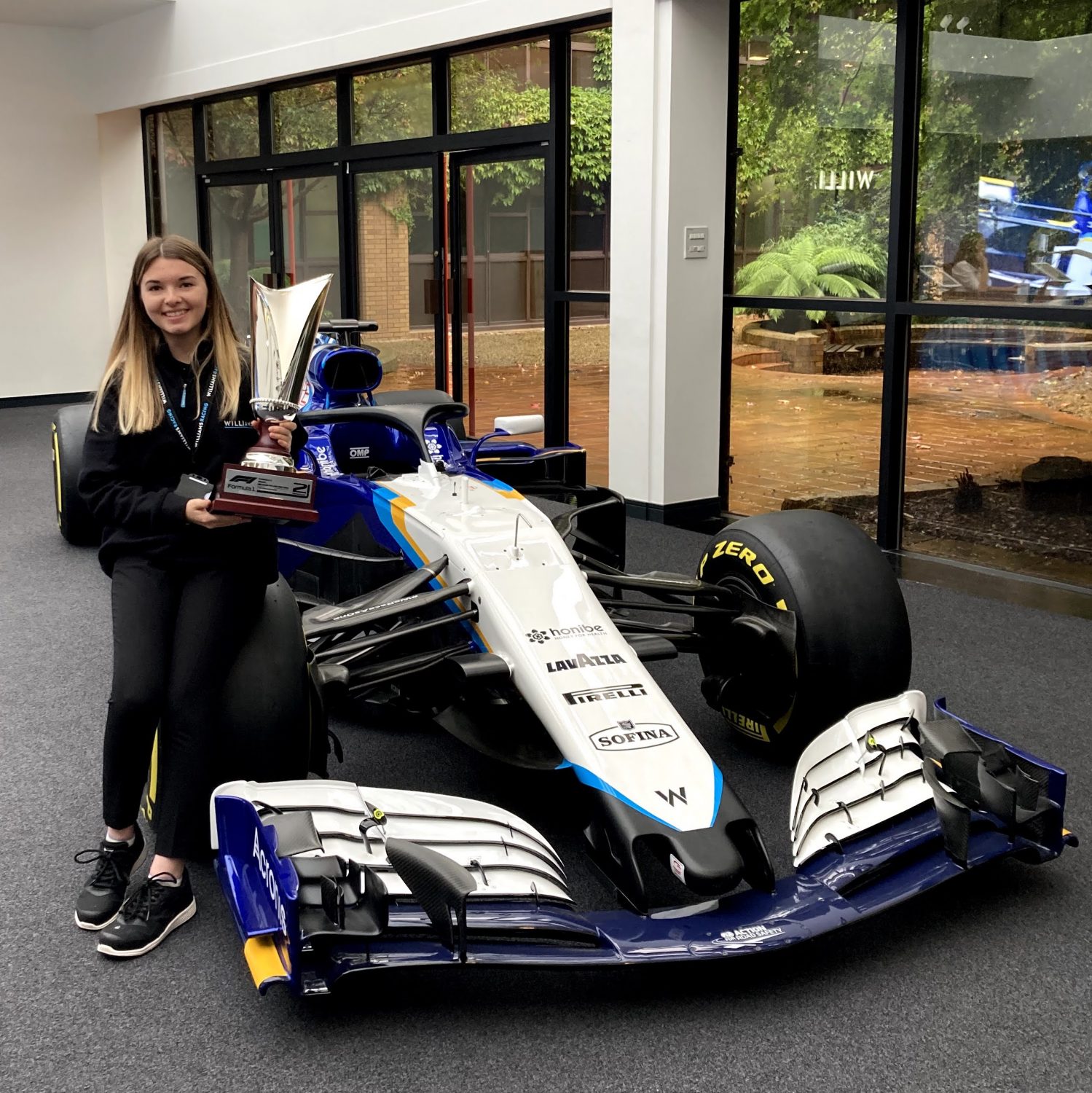 SQ Amy with George Russell’s 2nd place trophy from the 2021 Belgian Grand Prix copy
